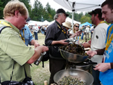 Best of the Country lunch - New Brunswick booth: Cliff Morrison, Saint John Ale House, serving some periwinkles, pan fried dulse (Palmaria palmata) in duck fat and IMTA kelp (Saccharina latissima) salad to Steve Johansen, Organic Oceanss.
