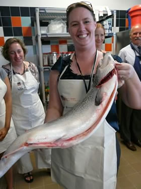  Ms. Erin Daily-Donahue (Trade Commissioner at the Canadian Consulate General in Boston) takes her salmon to her laboratory kitchen position